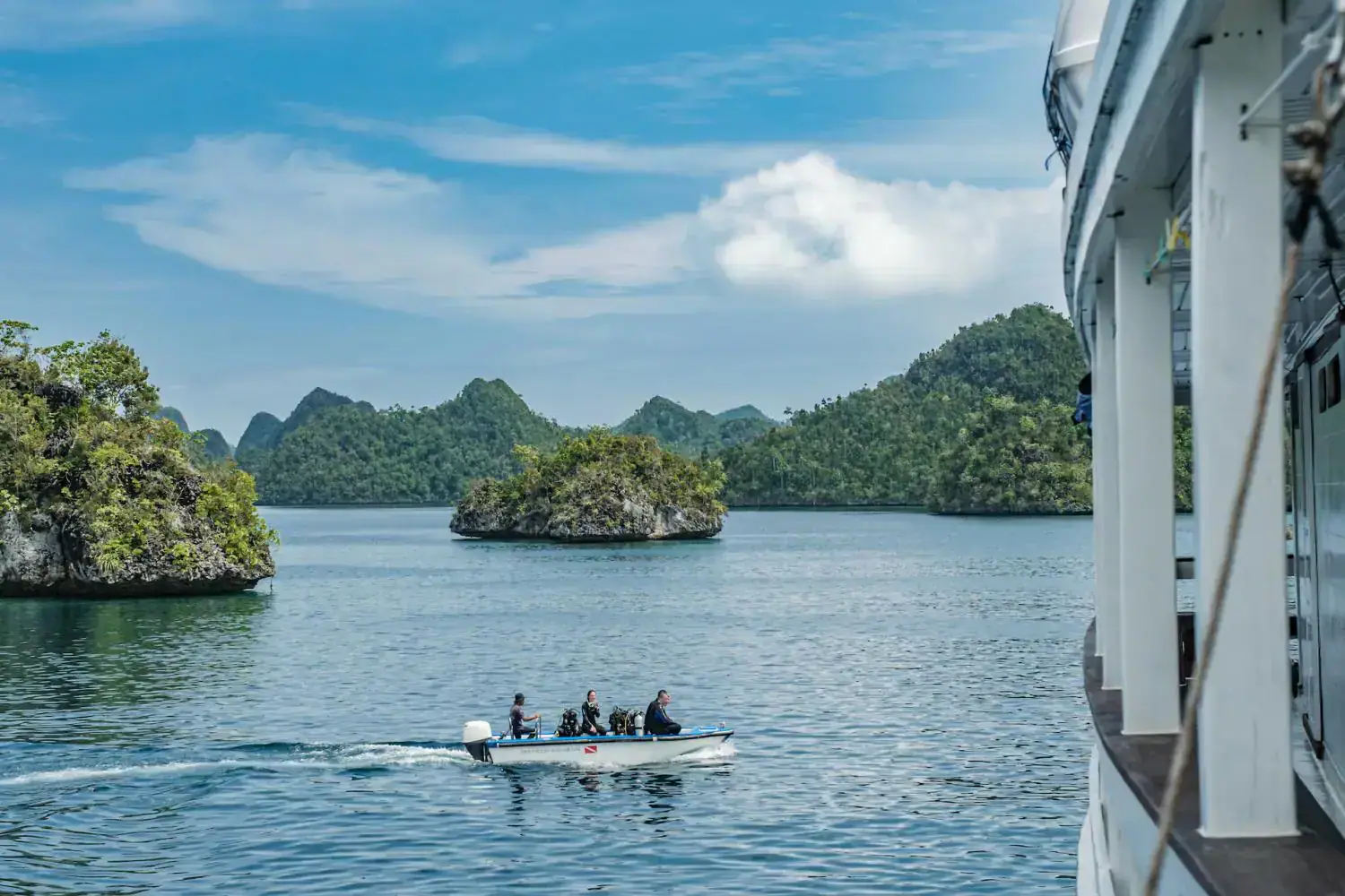 mv ambai dinghy, archipelago, green hills, sea view 