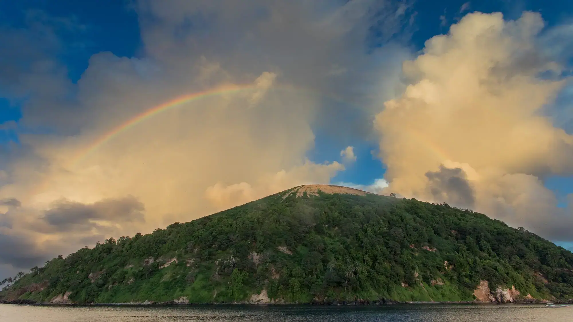 destination banda manuk, green hill, cloudy sky, rainbow