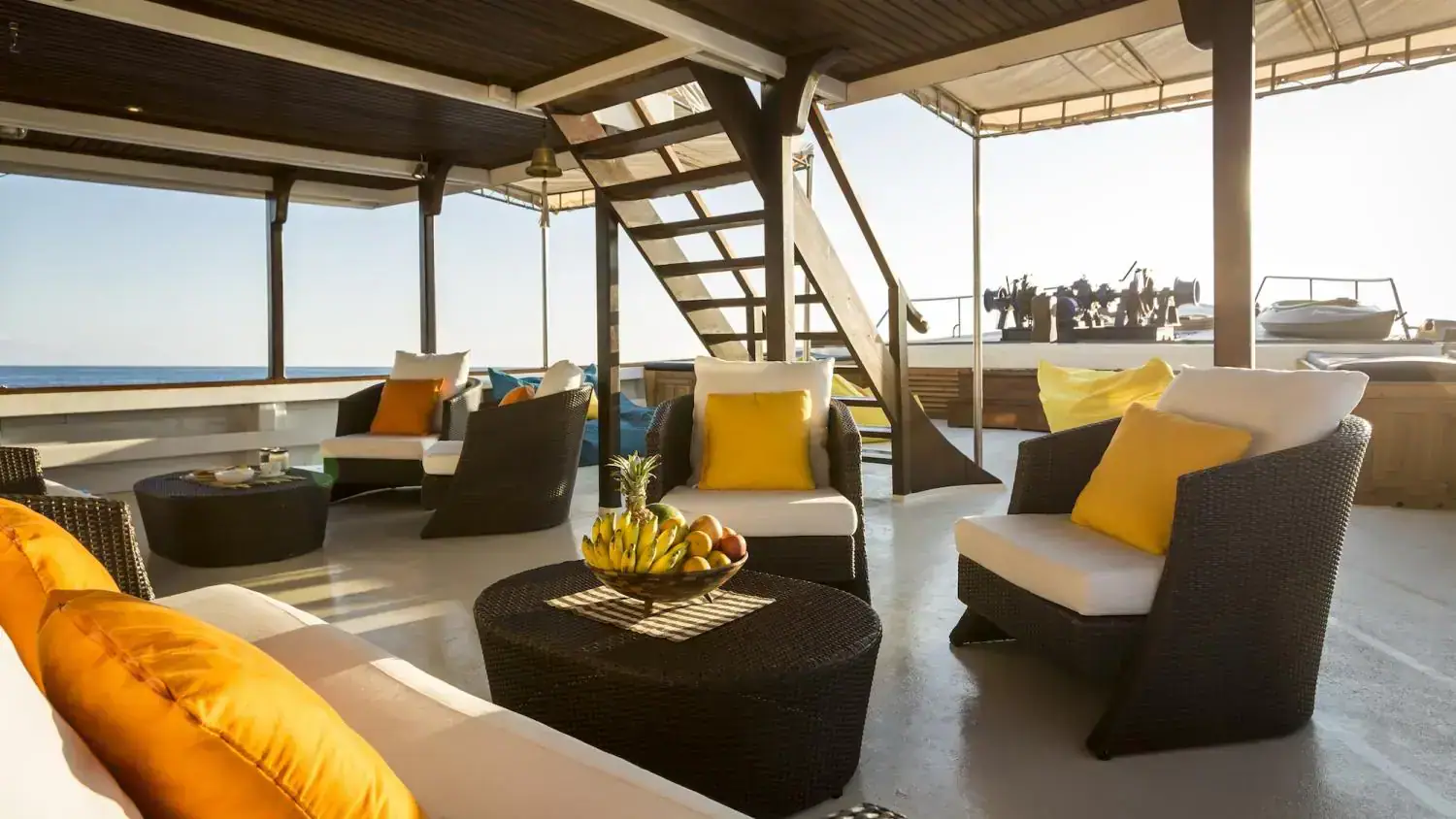 outdoor lounge, relaxing spot, exterior living area , beautiful sea view, sofa and outdoor couch, clear sky