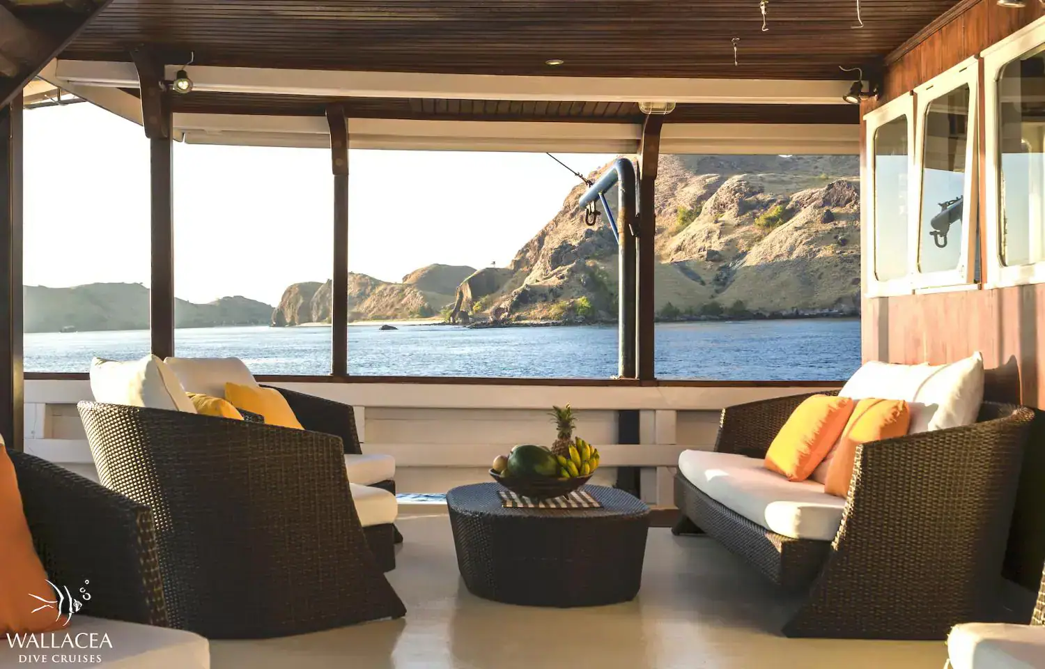 outdoor lounge, relaxing spot, exterior living area , beautiful sea view, hills in the background, sofa and outdoor couch