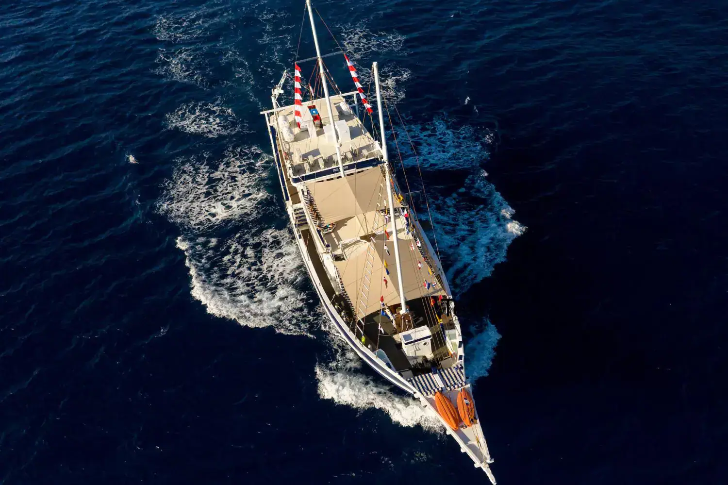 seahorse from the air, seahorse drone view, sailing vessel, deep blue water surrounding 