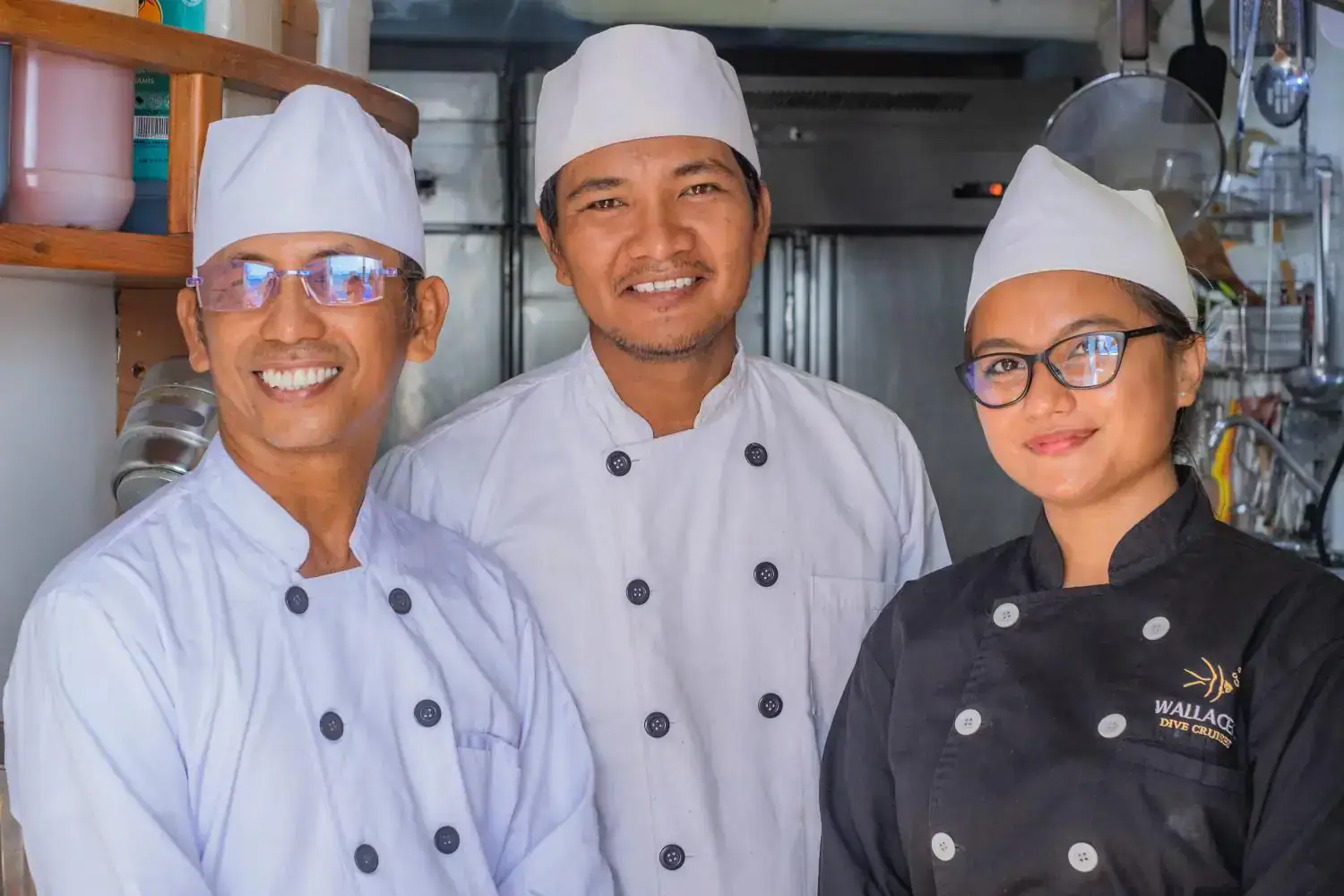 the chefs, chefs smiling, chefs in the yacht kitchen