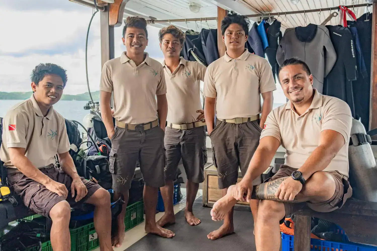 the crews, crew members smiling, crews standing in the dive center