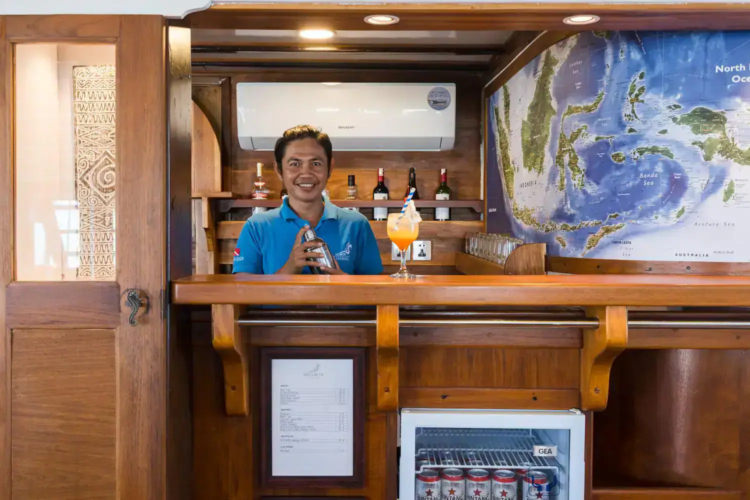 the restaurant bartender, crew, onboard service, wooden interior