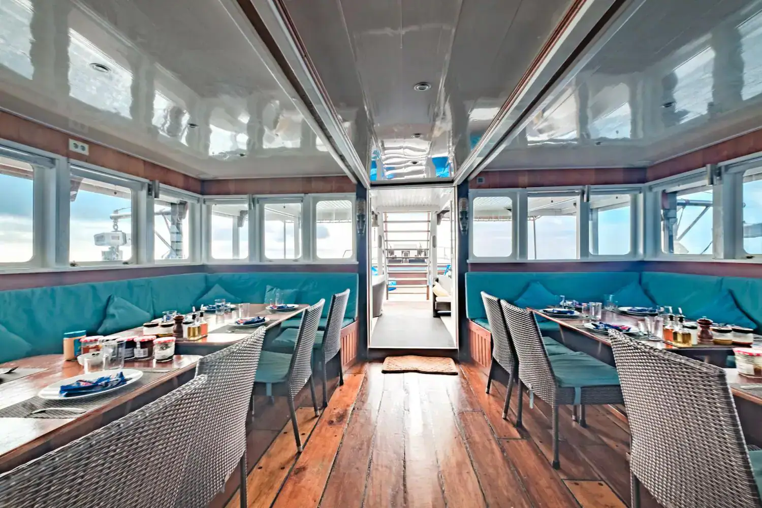 the restaurant c, interior, indoor living area, blue sofa, dining tables
