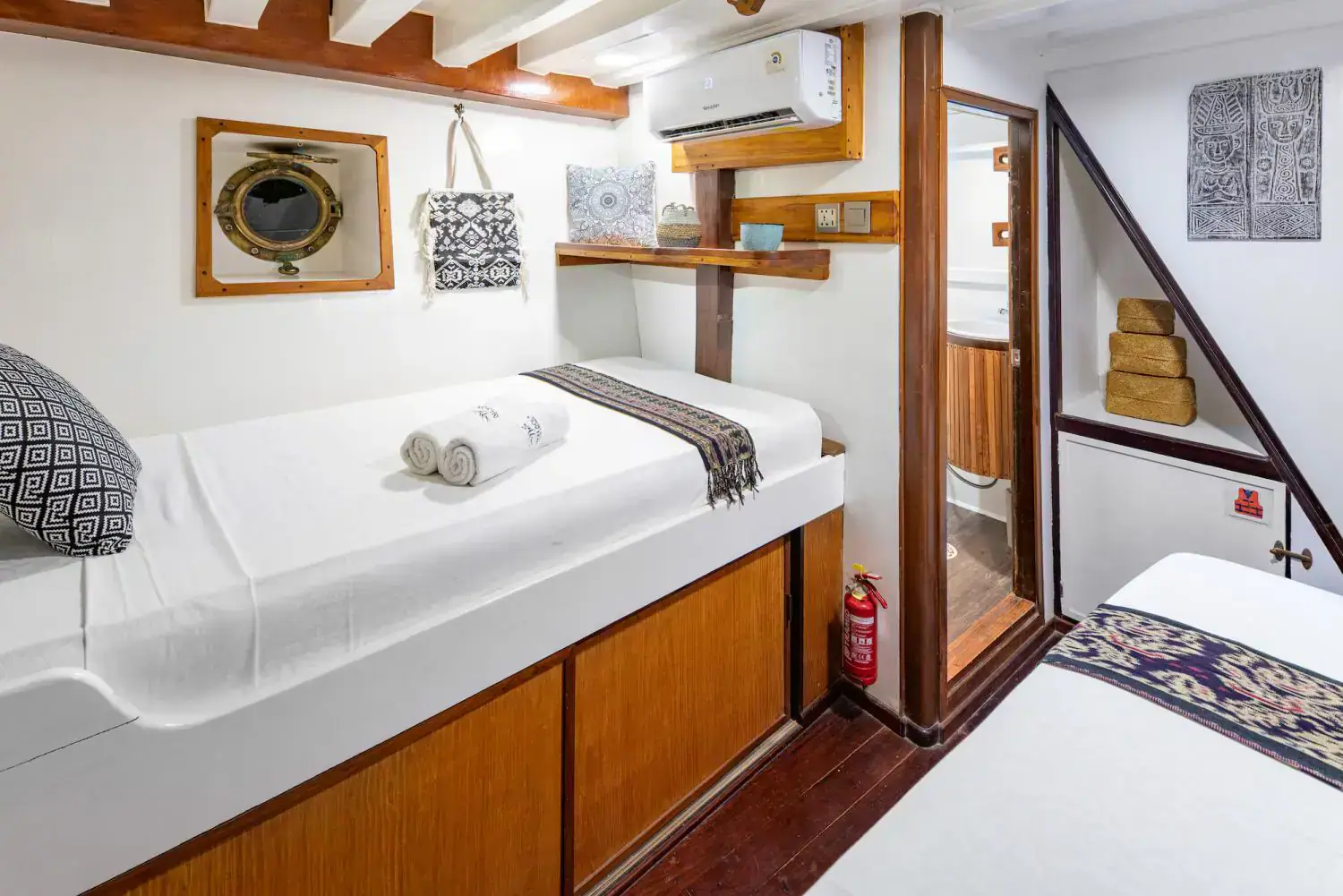 twin bed lower deck cabin, wooden details interior, AC, private bathroom